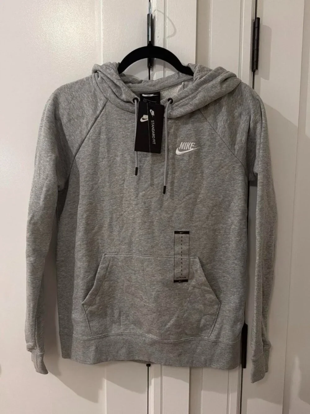 Gray Nike hoodie with drawstring hood and front pocket